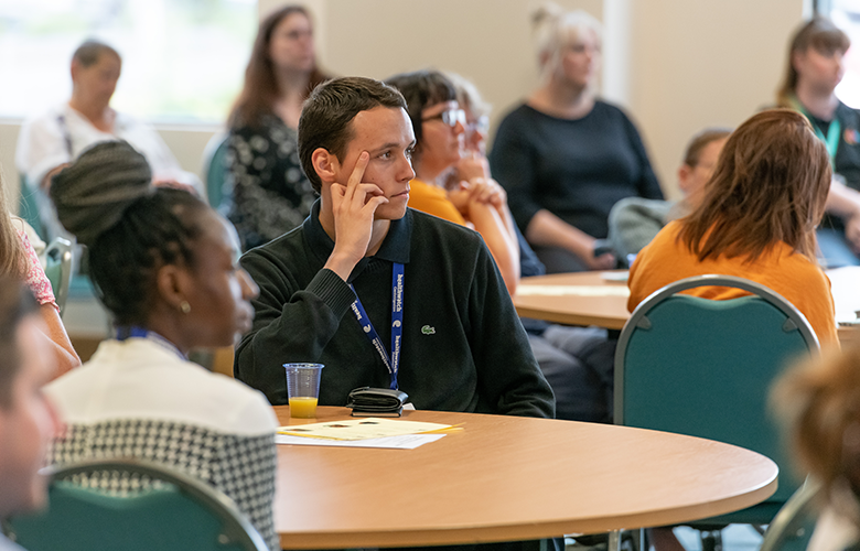 People at Championing Access event listening to the speaker 