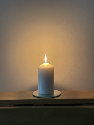 A candle lit in memory of Elspeth Jones