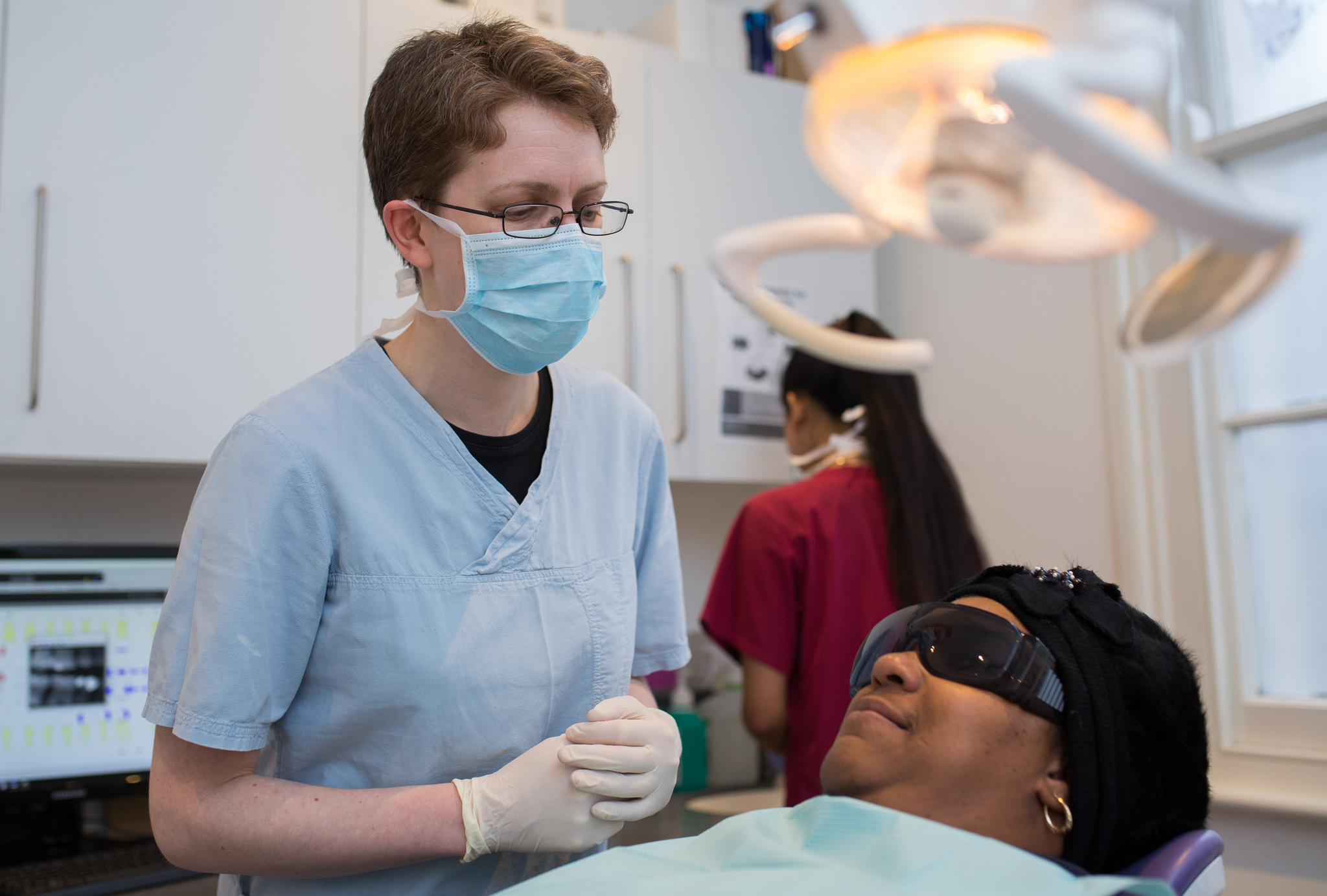 NHS dentist with patient
