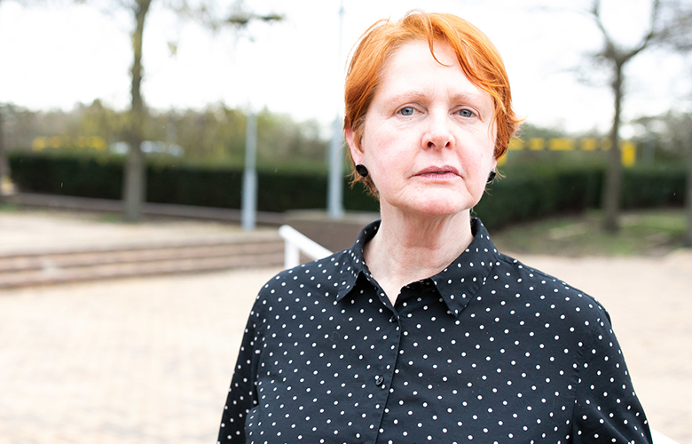 woman outside looks at camera