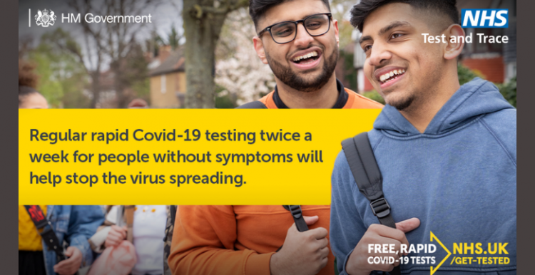 Everyone is urged to get tested regularly Two young men socialising outside