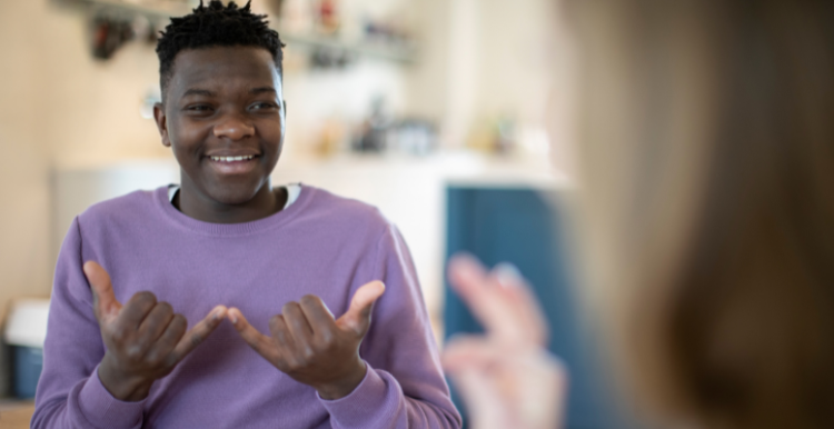 Young person communicating in British Sign Language