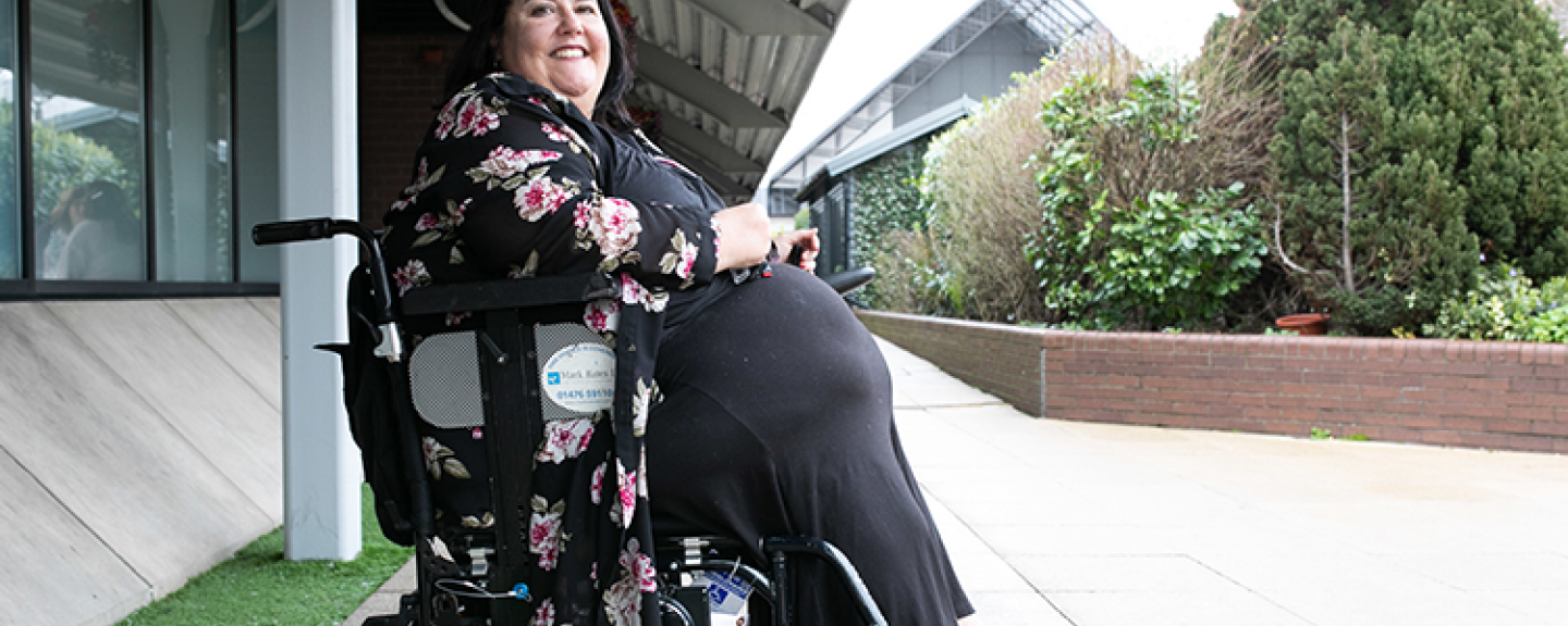 Woman in wheelchair outside- 