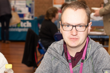Picture shows man at Healthwatch event looking at the camera