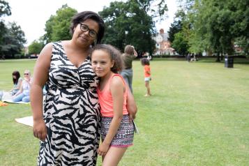 Mother and daughter smiling at the camera at Healthwatch event