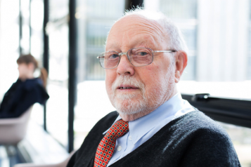 older man sitting in a hospital