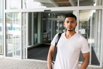 young man outside hospital