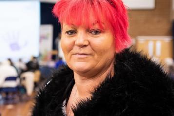 lady with red hair looking at camera