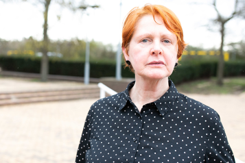 Woman looking at camera at a Healthwatch event 