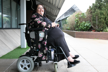 woman in power wheelchair