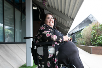 smiling lady in wheelchair