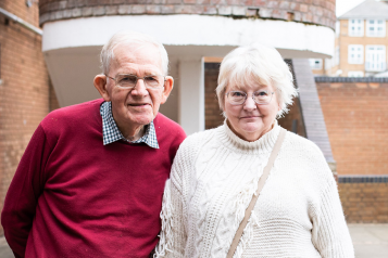 Picture taken at a healthwatch event shows older man and woman looking at the camera