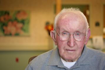 Picture shows older man looking at camera