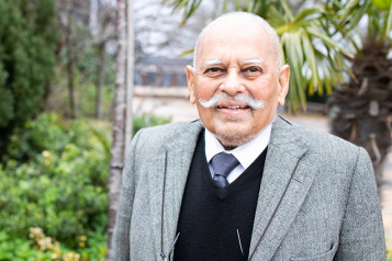 Picture shows older man of South Asian origin looking at the camera