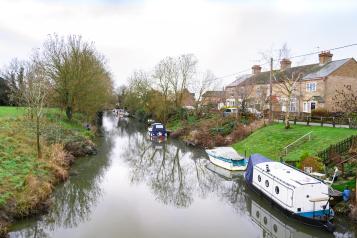 Canal boats on river