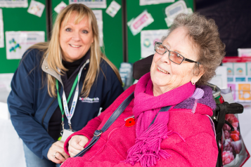 Woman in wheelchair with Healthwatch staff member