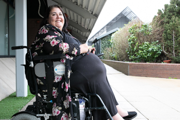 Woman in wheelchair outside- 
