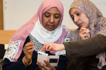 Two women using a smartphone