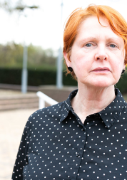 Woman looking at camera at a Healthwatch event 