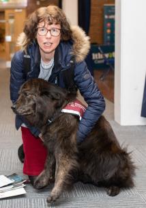 Woman with sensory dog at Healthwatch event 